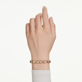 Bransoletka Millenia z kryształami o szlifie ośmiokątnym, w kolorze karmelowym, pokryta powłoką w odcieniu złota Bransoletka Millenia z kryształami o szlifie ośmiokątnym, w kolorze karmelowym, pokryta powłoką w odcieniu złota